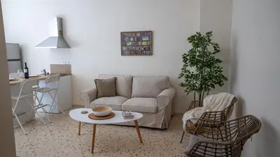 a living room with a couch and a table at Athens Glance Boutique Apartments in Athens
