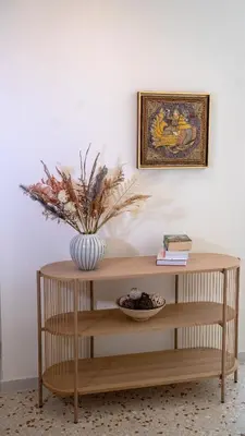 a table with a vase on top of it at Athens Glance Boutique Apartments in Athens