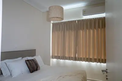 a bedroom with a bed and a window at Athens Glance Boutique Apartments in Athens