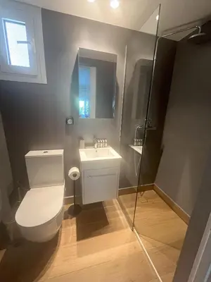a bathroom with a toilet and a sink at Riviera Studio in Athens