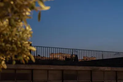 a fence on the top of a building at Ethereal Athεns in Athens