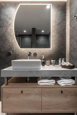 a bathroom with a sink and a mirror at Ethereal Athεns in Athens
