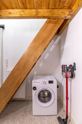 a washer and dryer in a bathroom under a roof at Petralona's Green House in Athens
