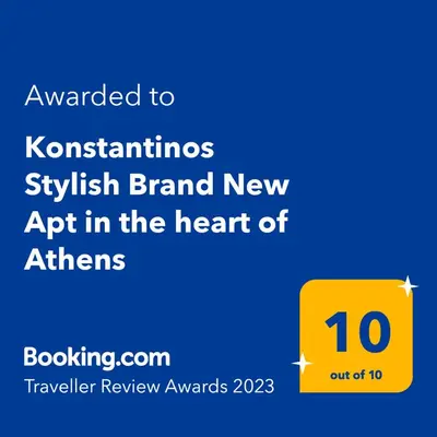 a yellow sign with the text awarded to kotskuskuskrit brand new app at Konstantinos Stylish Brand New Apt in the heart of Athens in Athens