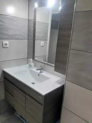a bathroom with a sink and a mirror at A convenient apartment in the heart of Athens in Athens