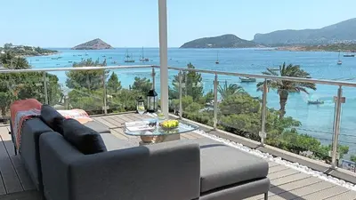 a living room with a couch and a view of the ocean at PORTO BLUE LUXURY APARTMENT in Porto Rafti