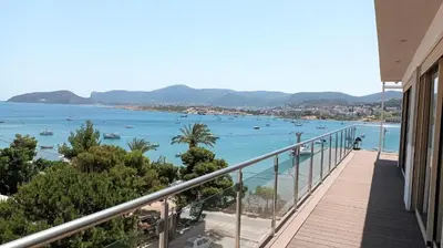 a balcony of a house with a view of the ocean at PORTO BLUE LUXURY APARTMENT in Porto Rafti