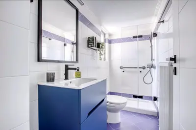 a bathroom with a sink and a toilet and a shower at Sunny & cosy apt with balcony in Peristeri! in Athens