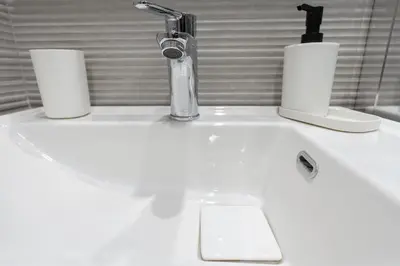 a sink with two rolls of paper towels and a faucet at Studio Ag Ioannis m station 1 bed 2 pers by MPS in Athens