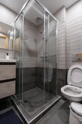 a bathroom with a shower and a toilet at Studio Ag Ioannis m station 1 bed 2 pers by MPS in Athens