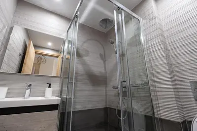 a bathroom with a shower and a sink at Studio Ag Ioannis m station 1 bed 2 pers by MPS in Athens