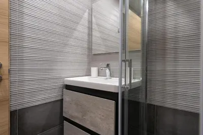 a bathroom with a sink and a glass shower at Studio Ag Ioannis m station 1 bed 2 pers by MPS in Athens