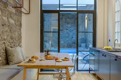 a kitchen with a table with food on it at Incomparable Plaka's Luxury Apt Private Pool in Athens