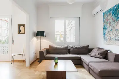 a living room with a couch and a table at Elegant 2 Bedroom 2 Bathroom Apartment in Athens Vibrant Centre! VL5 in Athens