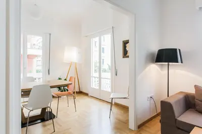 a living room with a table and a couch at Elegant 2 Bedroom 2 Bathroom Apartment in Athens Vibrant Centre! VL5 in Athens