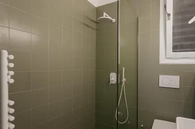 a bathroom with a shower with a glass door at Elegant 2 Bedroom 2 Bathroom Apartment in Athens Vibrant Centre! VL5 in Athens