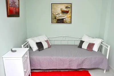 a bedroom with a bed with two pillows on it at Koukaki sunshine roof apartment in Athens
