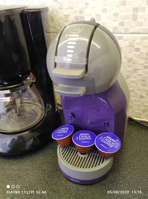a purple mixer sitting on a counter with cupcakes at Koukaki sunshine roof apartment in Athens