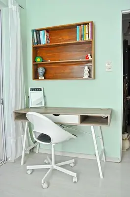a desk with a chair and a book shelf at Koukaki sunshine roof apartment in Athens