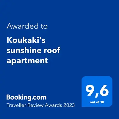 a screenshot of a phone with the text awarded to kukkas sunshine root at Koukaki sunshine roof apartment in Athens