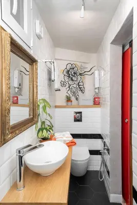 a bathroom with a sink and a toilet at Cozy tiny apartment in the heart of Plaka in Athens