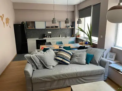 a living room with a couch and a table at Athens Historical Centre 2 Bedroom Apt. in Athens
