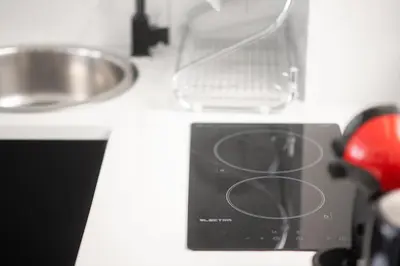 a kitchen counter with a sink and a appliance at Athenian Dream Suite in Athens