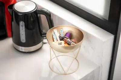 a small bowl on a counter next to a coffee pot at Athenian Dream Suite in Athens