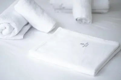 a pile of towels and a napkin on a counter at Athenian Dream Suite in Athens