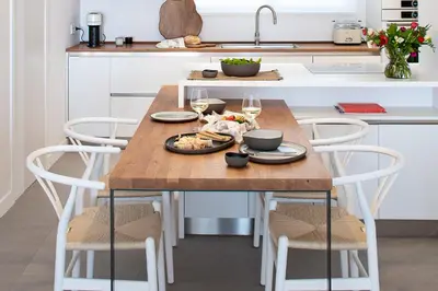 a kitchen table with a plate of food on it at LazySun in Sounio