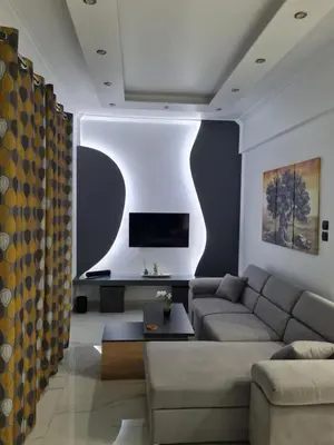 a living room with a couch and a tv at Jenny's Dream Home -Acropolis Lux 2 Bedroom Apt, with Hot Tub, free Netflix, fast Wifi in Athens