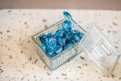 a basket full of blue bows sitting on a counter at Athens Loft in Athens