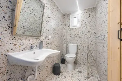 a bathroom with a sink and a toilet at Athens Loft in Athens
