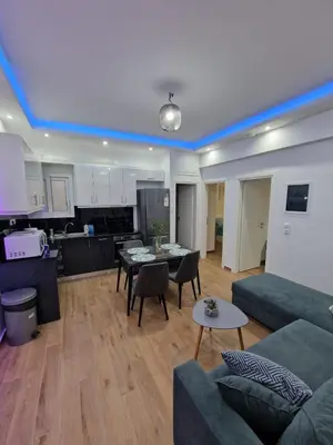a living room with a couch and a table at Luxury apartment in Sepolia in Athens
