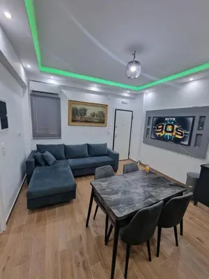 a living room with a couch and a table at Luxury apartment in Sepolia in Athens