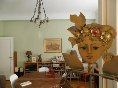 a living room with a table with a head on it at Elegant 3BD apartment in Kolonaki in Athens