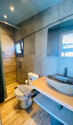 a bathroom with a toilet and a sink at 200Mbps Wifi - Penthouse With Acropolis View in Athens