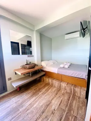 a bathroom with two beds and a sink at 200Mbps Wifi - Penthouse With Acropolis View in Athens
