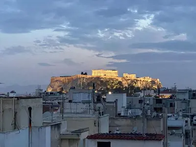 a building on top of a mountain with buildings at 200Mbps Wifi - Penthouse With Acropolis View in Athens