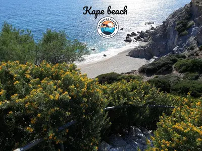 a view of a beach with a sign that says rave beach at Patroclos SeaView in Sounio