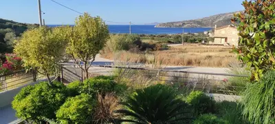 a view of a garden from the balcony of a house at Patroclos SeaView in Sounio