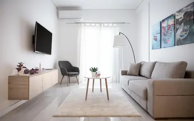 a living room with a couch and a table at Acropolis Urban Life in Athens