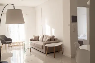 a living room with a couch and a table at Acropolis Urban Life in Athens