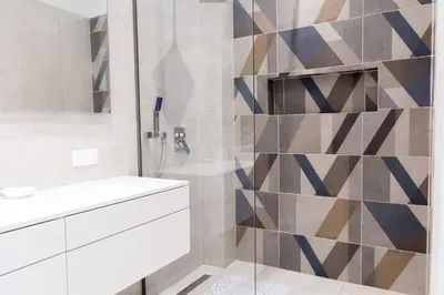 a bathroom with a shower and a white sink at Acropolis Urban Life in Athens