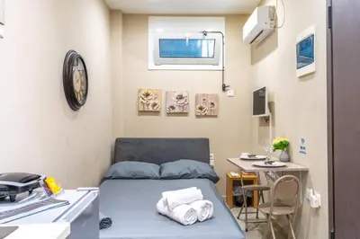 a hospital room with a bed and a table at AIOLOS LUXURY alimos market apartment 2 near the sea in Athens