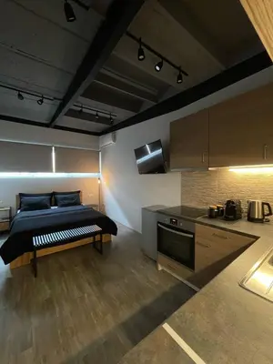 a bedroom with a bed in the middle of a room at Ermoo Athens Modern Living in Athens