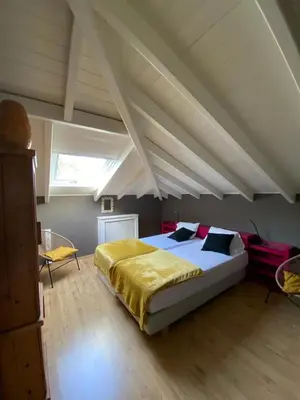 a bedroom with a large bed in an attic at Villa-Agave , by the sea in Porto-Rafti outside Athens in Porto Rafti