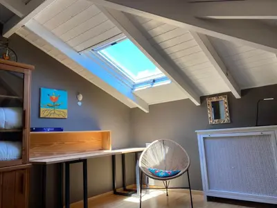 a skylight in a room with a desk and a chair at Villa-Agave , by the sea in Porto-Rafti outside Athens in Porto Rafti
