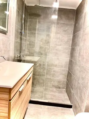 a bathroom with a shower and a sink at L apartment2 in Athens