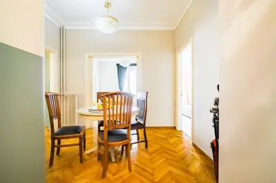 a dining room with a table and chairs at Emporikon Apartment Steps From Historic Center in Athens